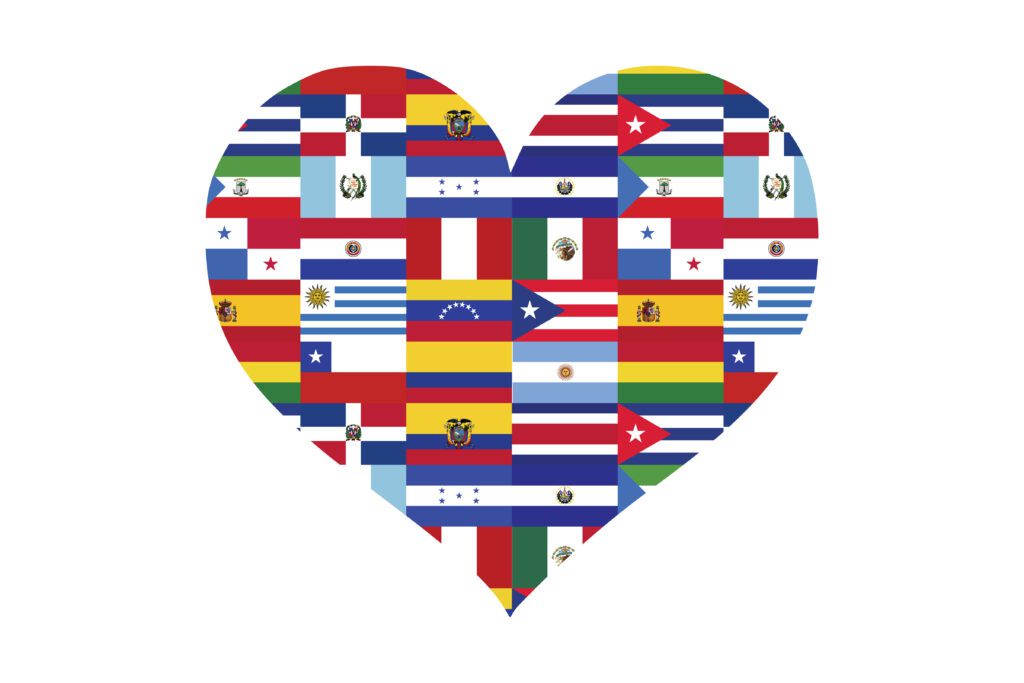 A heart shaped flag with many different countries flags on it.